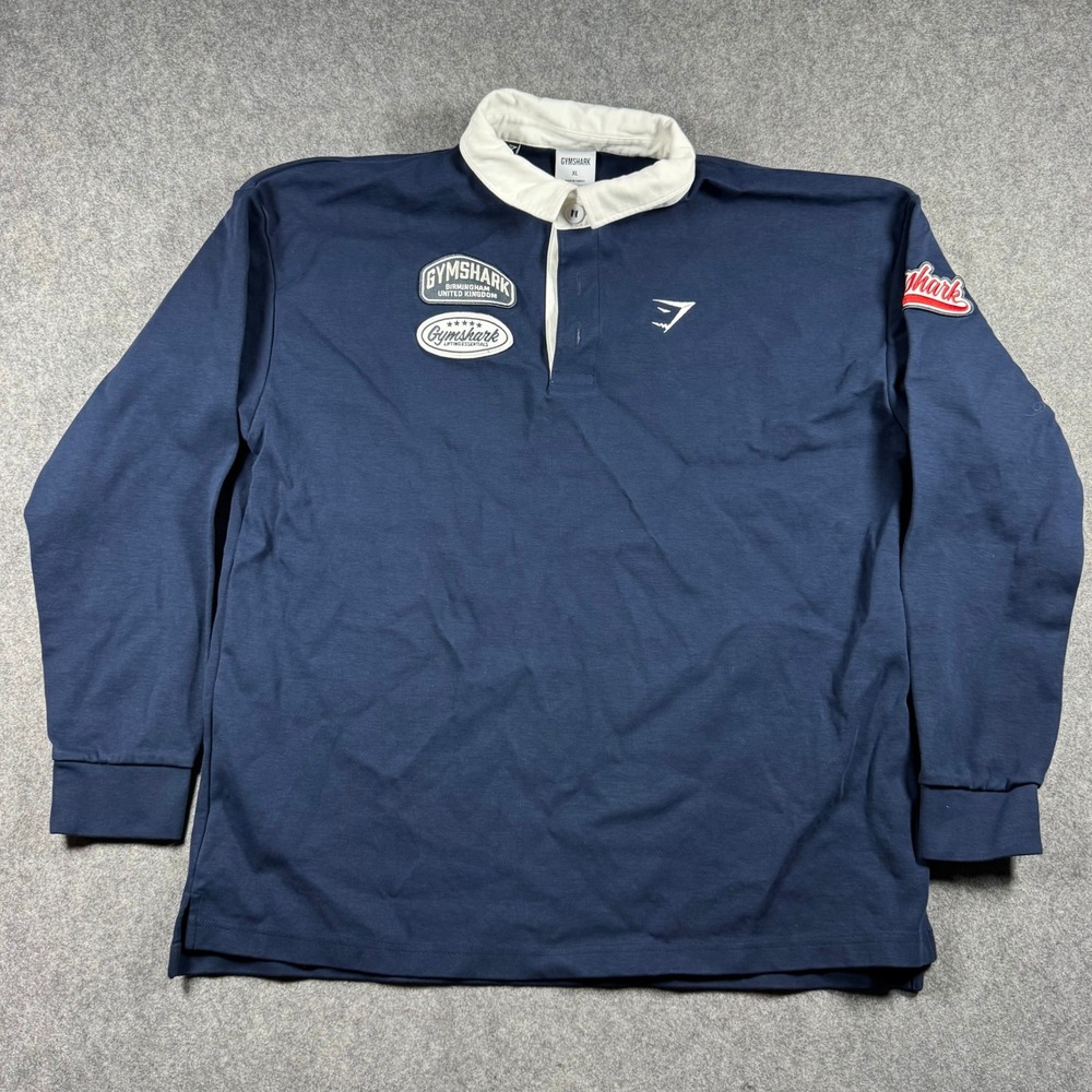 Gymshark Mens XL Navy Blue Long Sleeve Rugby Shirt Heritage Patch Logo Patches